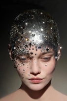 With this image it was the unusual silver head make-up that drew me to it. I love the way the light sparkles off the silver and the jewels, this would link in perfectly with my use of glitter to represent magic